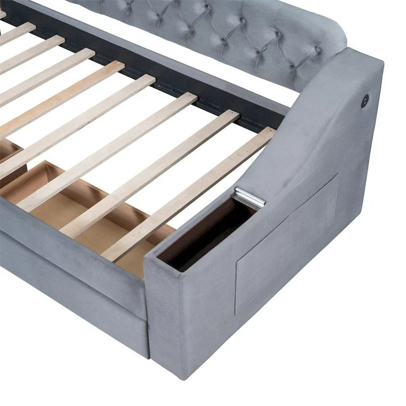 Divano letto a una piazza in velluto con braccioli portaoggetti e porta USB